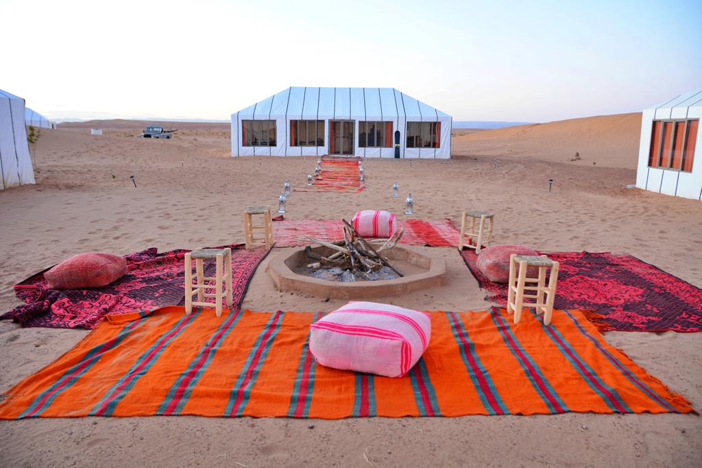 Fire pit and tent in Sahara desert