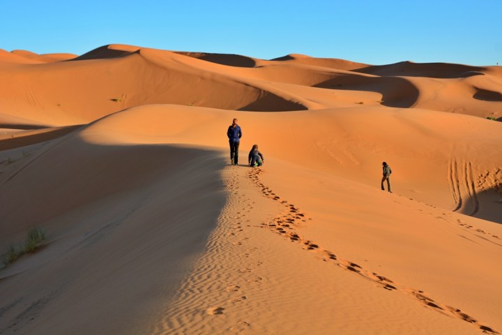 Kids playing in the Sahara desert, in Morocco