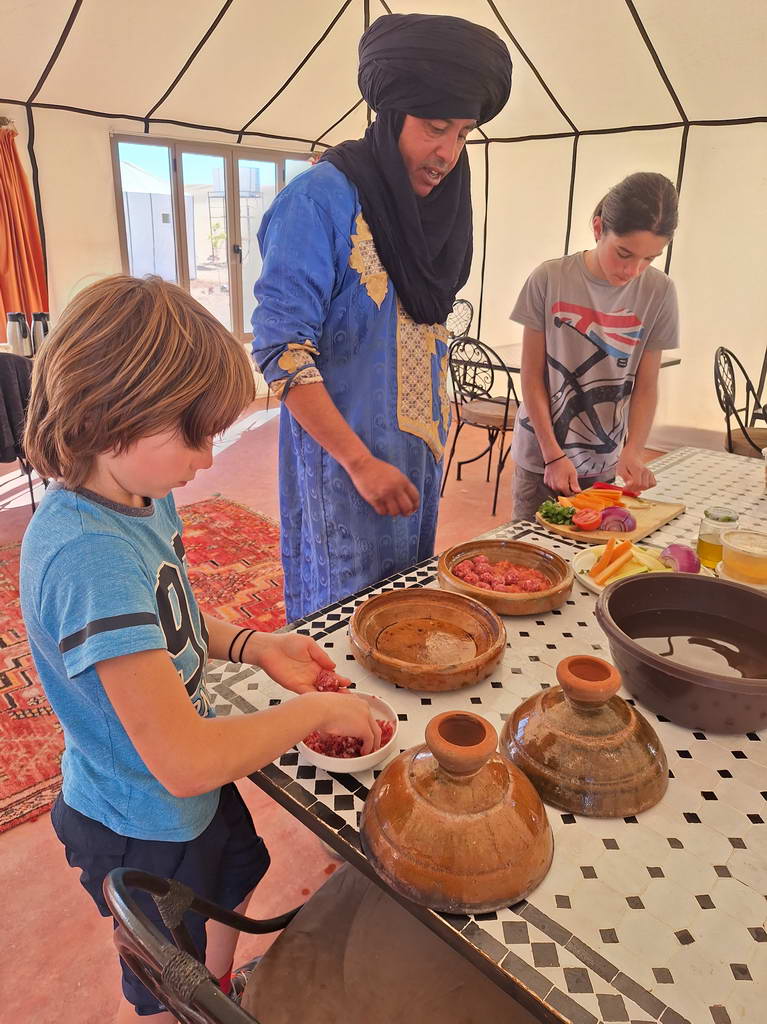 kids cooking tajine in Morocco
